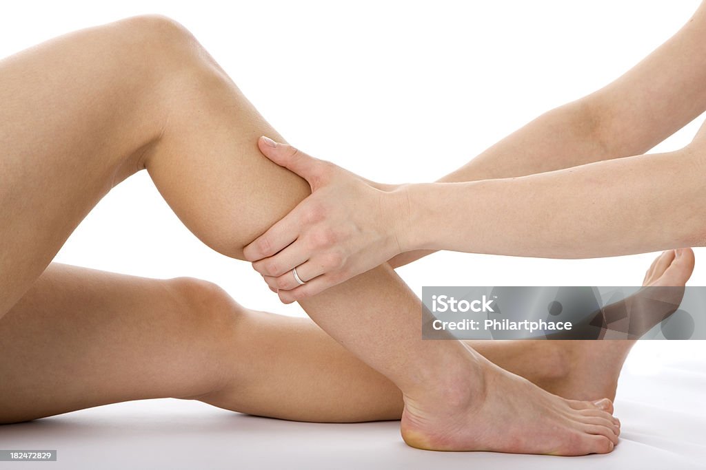 Gambe per massaggio - Foto stock royalty-free di Adulto