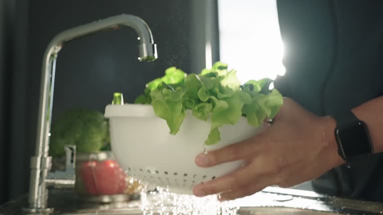 Washing vegetables.