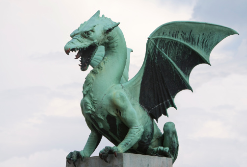 Dragon sculpture of the Dragon Bridge over Ljubljana River in the capital of Slovenia.