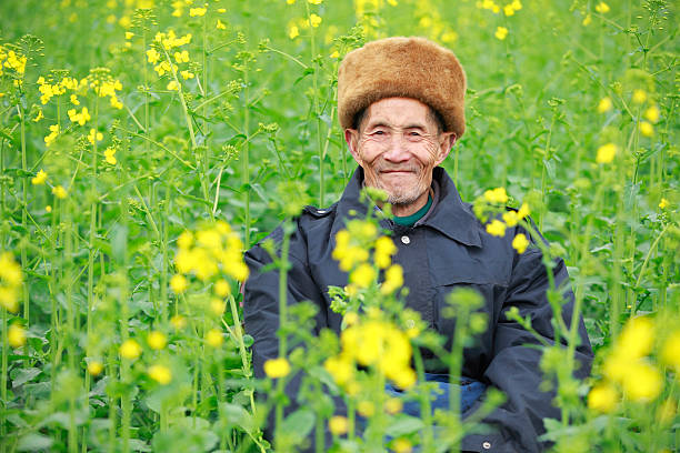 istock senior man sitting in the flower 182473208