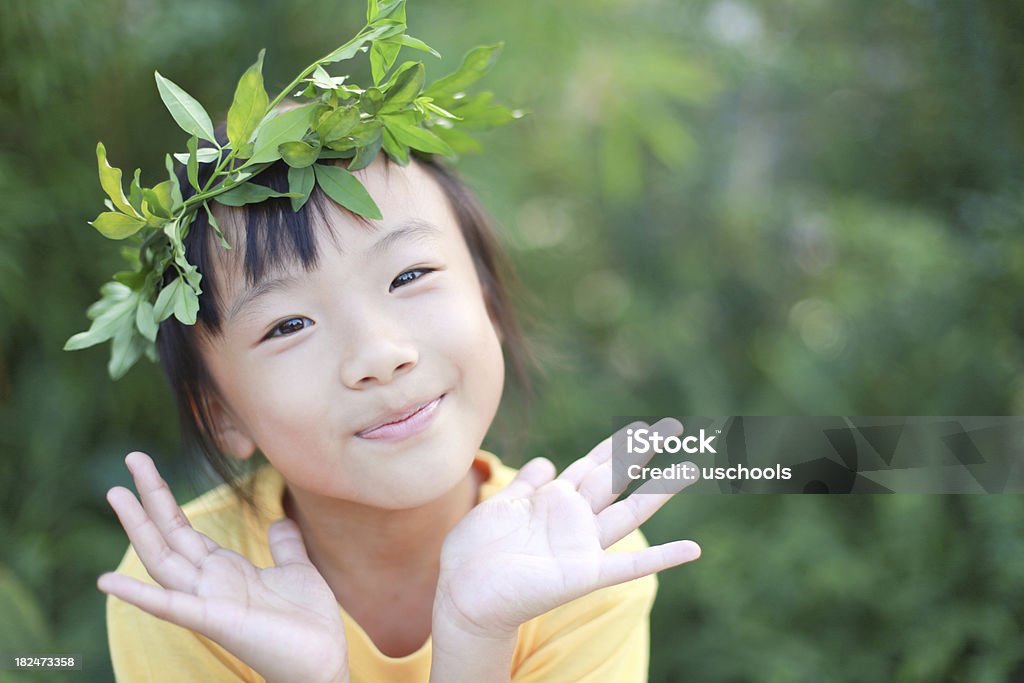Cute Little Asian Girl Looking at Camera  Laurel Wreath Stock Photo