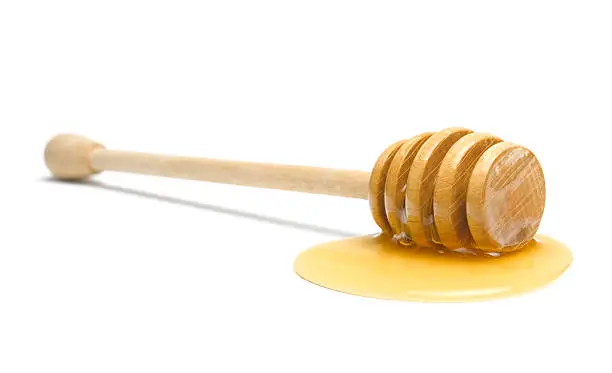isolated dipper with honey drizzle