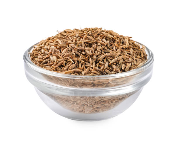 istock Bowl of aromatic caraway (Persian cumin) seeds isolated on white 1824736312