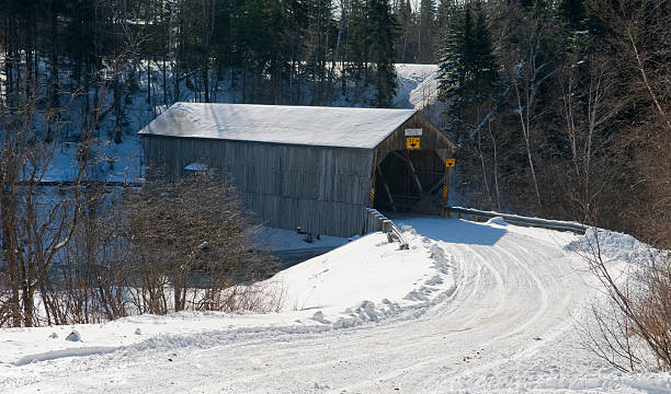 istock Covered Bridge on country road in winter 182473659
