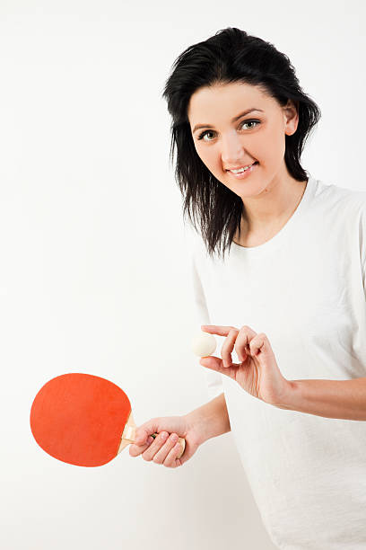 istock woman with ping pong racquet smile 182474032