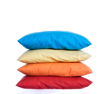 stack of four colorful pillows