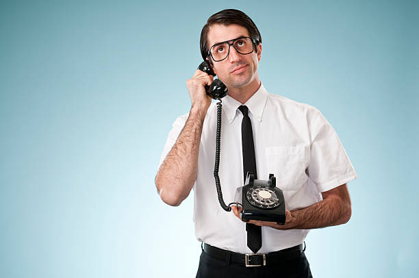 istock Nerdy Office Worker With Vintage Telephone 182474225