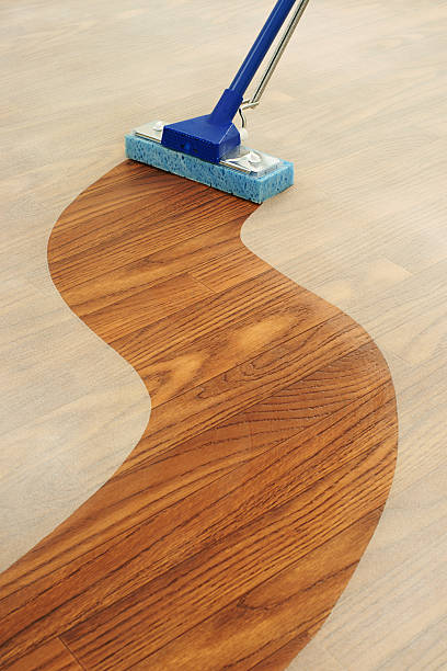 Sponge Mop Cleaning a Path Across  Dusty Floor