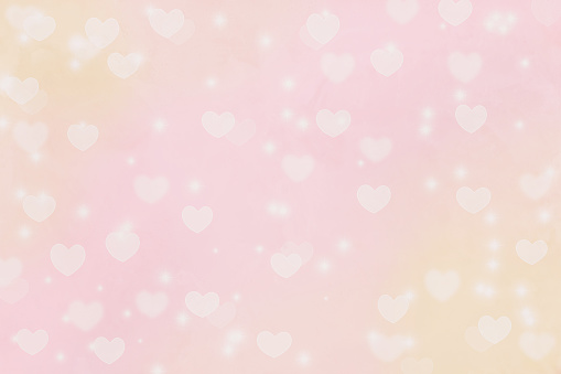 Beautiful bright blurred pink and gold pastel Valentines Day abstract bokeh background.