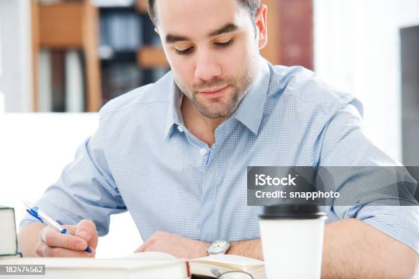 Low Depth Photo Of A Man Working At His Desk With Coffee Stock Photo - Download Image Now