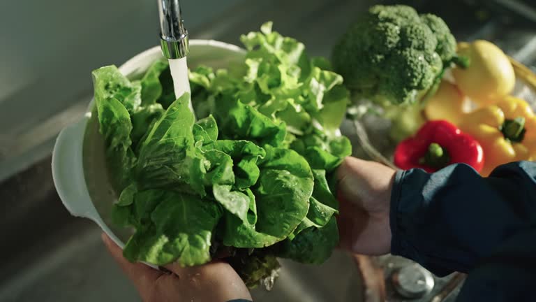 Washing vegetables.