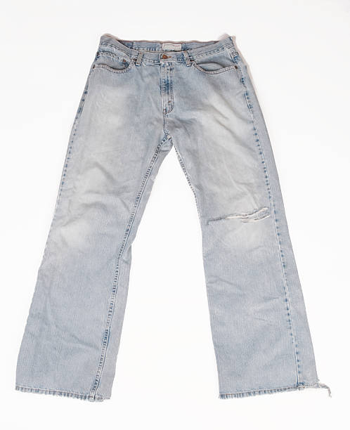 istock Worn Aged Jeans with Hole in Leg 182474971
