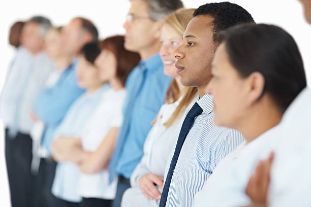 istock Group of business colleagues standing in a row 182475088