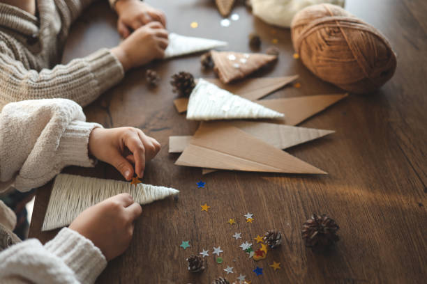 istock Children making Christmas decorations from yarn 1824753887