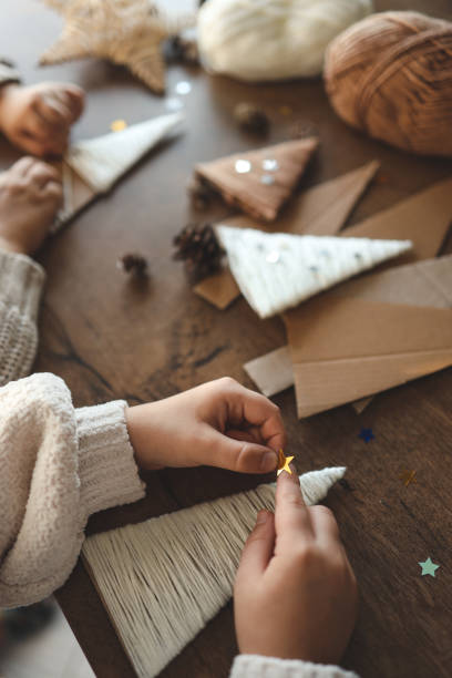 istock Children making Christmas decorations from yarn 1824753894