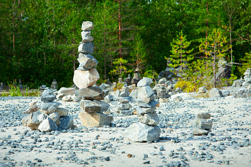 The practice of mental health. Manual installation of natural stone for balancing. Harmony and positive mind. Relaxed spiritual hand arrangement, tower enjoying life
