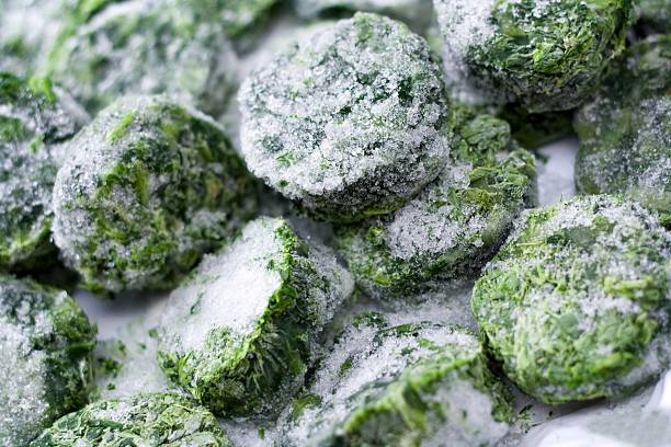 Frozen spinach "Frozen spinach, (Variation shot)" spinach stock pictures, royalty-free photos & images
