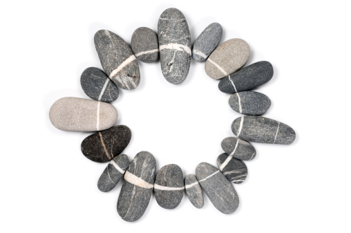 Circular frame made of with stones on white background