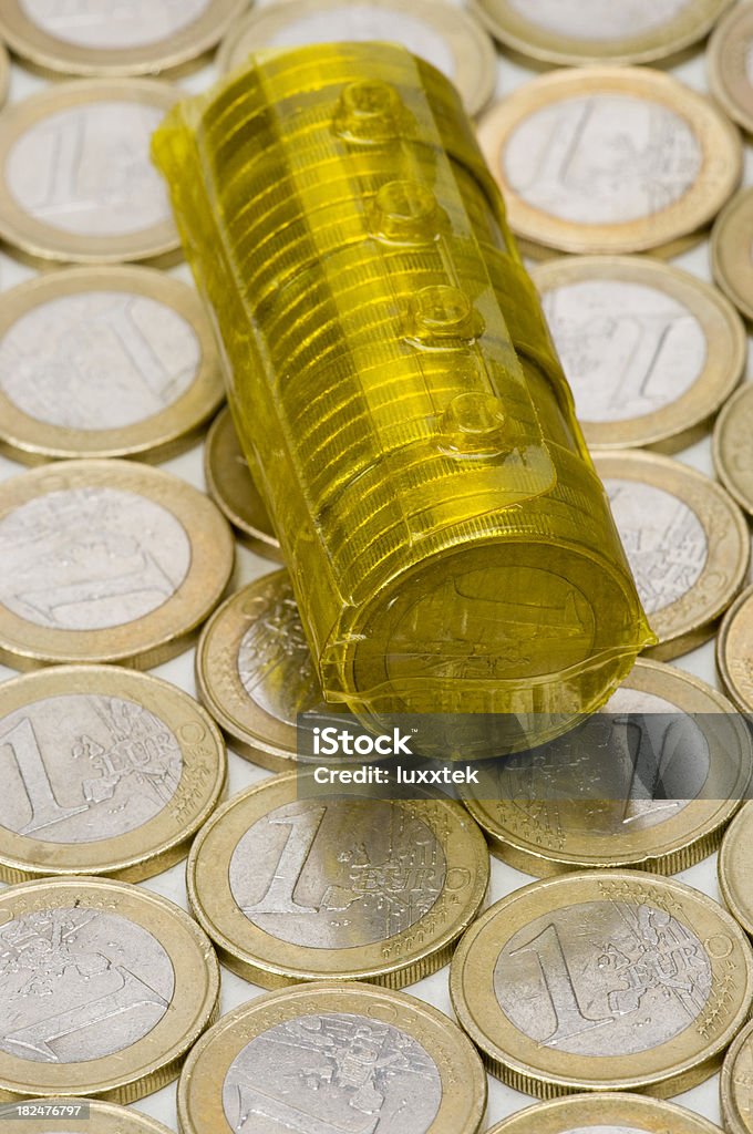 Reusable coin roll on euro coins background Abstract Stock Photo