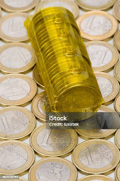 Reusable Coin Roll On Euro Coins Background Stock Photo - Download Image Now - Abstract, Business, Coin