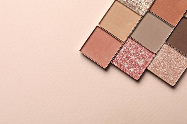 istock Different beautiful eye shadows on beige background, flat lay. Space for text 1824777852