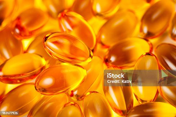 Vitamin Capsules Stock Photo - Download Image Now - Capsule - Medicine, Spilling, Vitamin E
