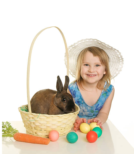 istock Cute Easter Girl with a Bonnet Basket Eggs and Bunny 182477984