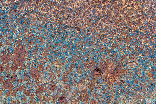 Grunge rusty metal background or texture with scratches and cracks, close up, top view
