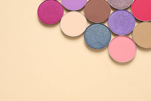 istock Different beautiful eye shadows on beige background, flat lay. Space for text 1824781074