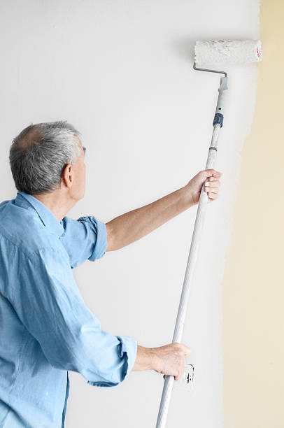 istock Man painting the wall 182478527