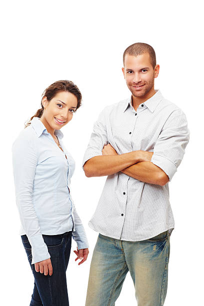 istock Young couple standing confidently against white 182478699