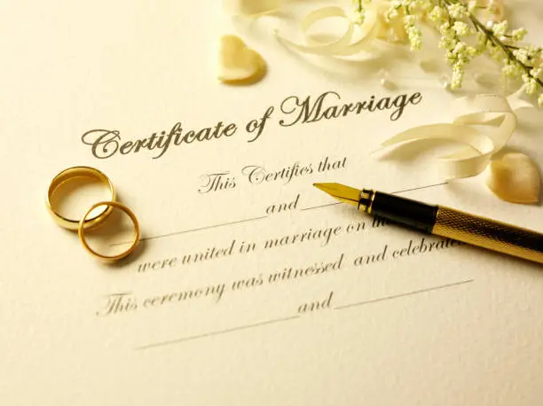 Photo of Certificate of Marriage and Pen