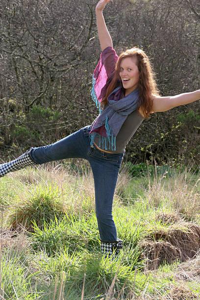 istock Happy Young Woman Jumping for Joy 182478992