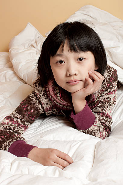 istock Little girls Laying On bed. 182479465