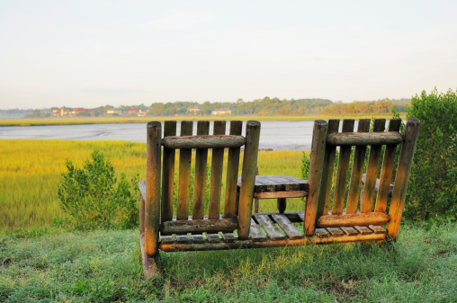 Please click my private lightbox links below for more images like this -- Thanks!Two chairs sit in early morning light overlooking the Amelia River and Marsh in Florida.  RAW source image processed with Nikon Capture NX version 1.3