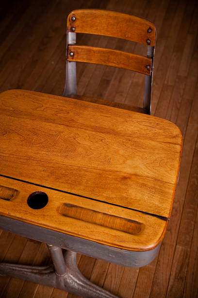 istock Empty Old School Desk on Hardwood Floor 182479685