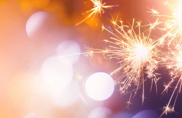 istock sparkling from fireworks and light bokeh. background for New Year's celebrations, banner design. on the dark blue night sky 1824798031