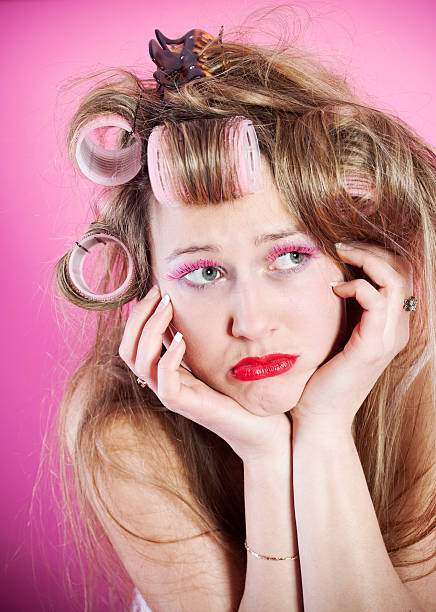 istock Crazy young woman with curlers 182479922