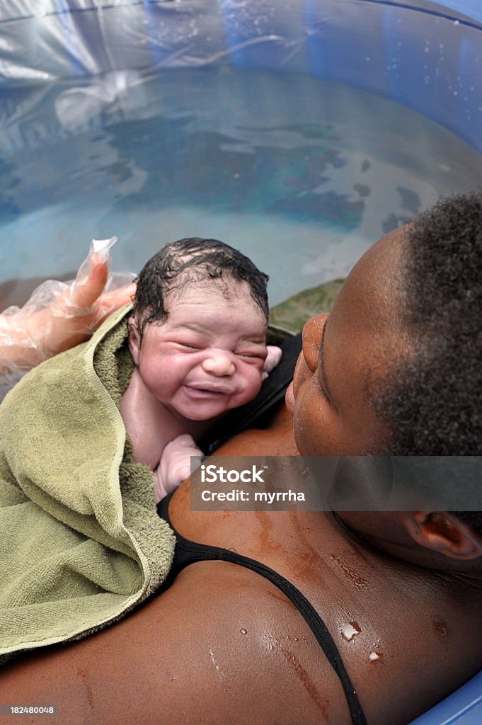 Baby Day~Water Birth; Mother and Newborn twenty seconds old, newborn and mother meet face-to-face (part of a series of the event) Childbirth Stock Photo