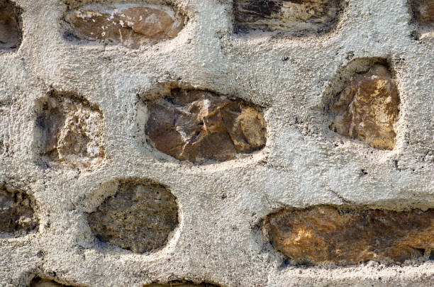 istock Ancient handcrafted stone wall. Close-up view of original brickwork. Typical architecture of Rome empire. Nature stone wall in Santo Stefano di Camastra, Sicily, Italy 1824800710