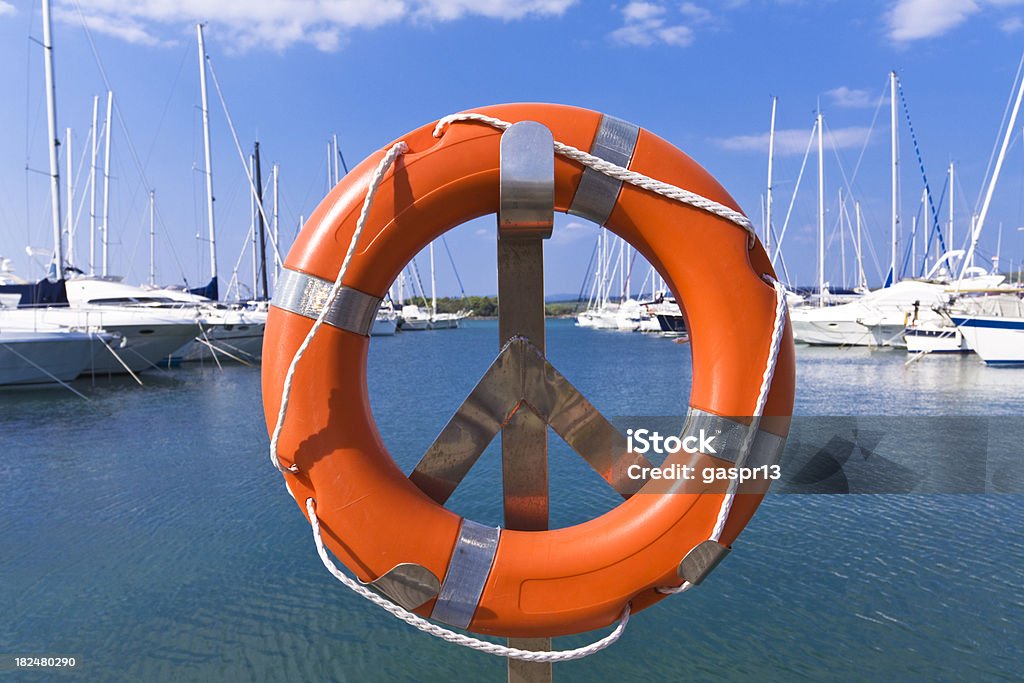 safety first life belt with a marina in the backgroundCHECK OTHER SIMILAR IMAGES IN MY PORTFOLIO.... Life Belt Stock Photo