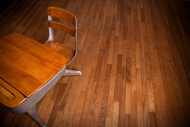 istock Empty Old School Desk on Hardwood Floor 182480431
