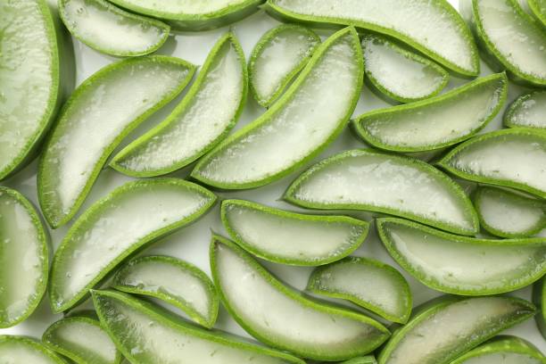 istock Fresh aloe vera slices on white background, flat lay 1824812488