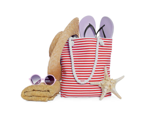 istock Stylish bag, starfish and other beach accessories isolated on white 1824820121