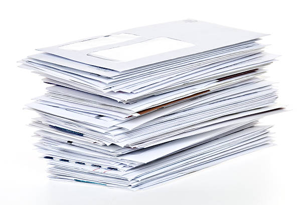 Stack of Unpaid Bills and Envelopes Isolated on White stock photo