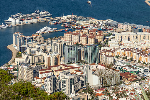 Elevated view of the north of the Westside area of Gibraltar, most of which was recovered from the sea. Some of the features seen in the photo are: Varyl Begg Estate, the North Mole, Harbour Views, the Cruise port, the Port of Gibraltar, a cruise whip, the mega-yacht Golden Odyssey and som eof the port's industrial facilities.