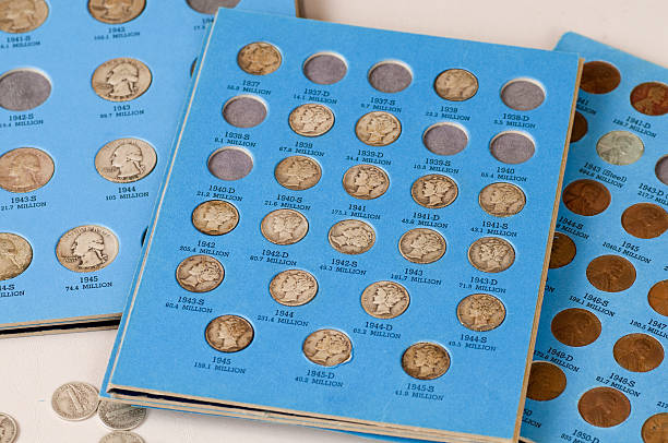 Old Coins - Series "Collection of old U.S. Quarters, Dimes,  and Pennies organized into coin collector's books.Also see:" canadian coin stock pictures, royalty-free photos & images