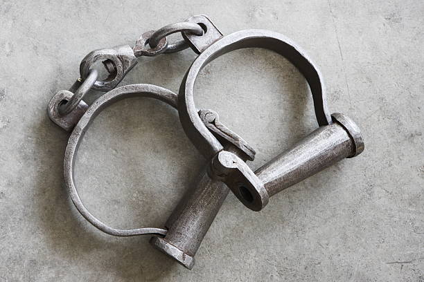 Close-up of a pair of antique metal slave shackles stock photo
