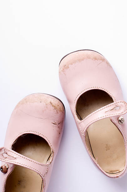 istock Child's First Pair Of Shoes Overhead View White Background 182483601
