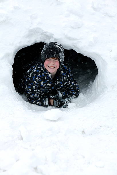 istock Boy Playing in Snow Fort 182483631
